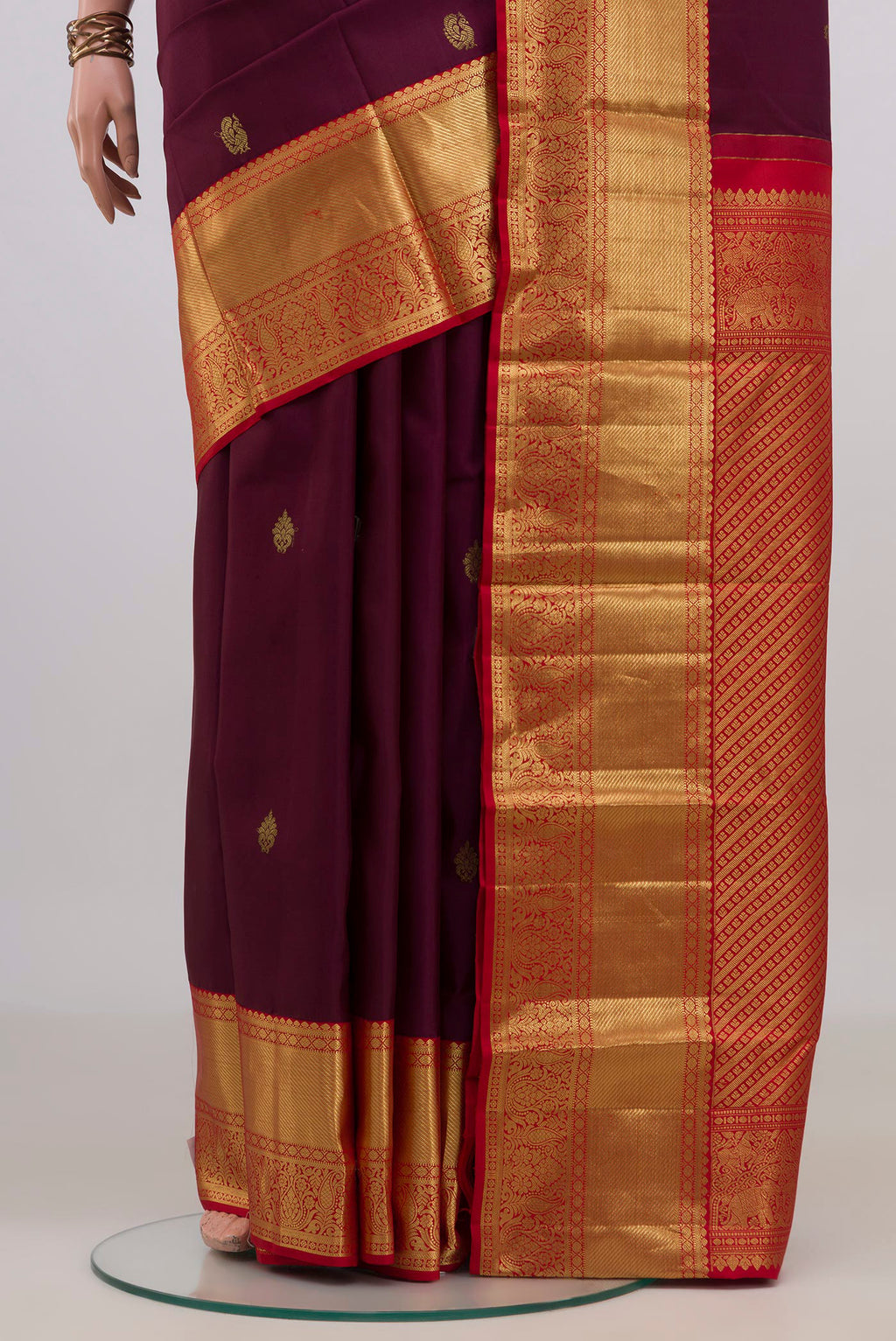 Pleats and pallu of Pure Silk Purple Kanjivaram Saree with Zari Butta on the body and Zari Border. 