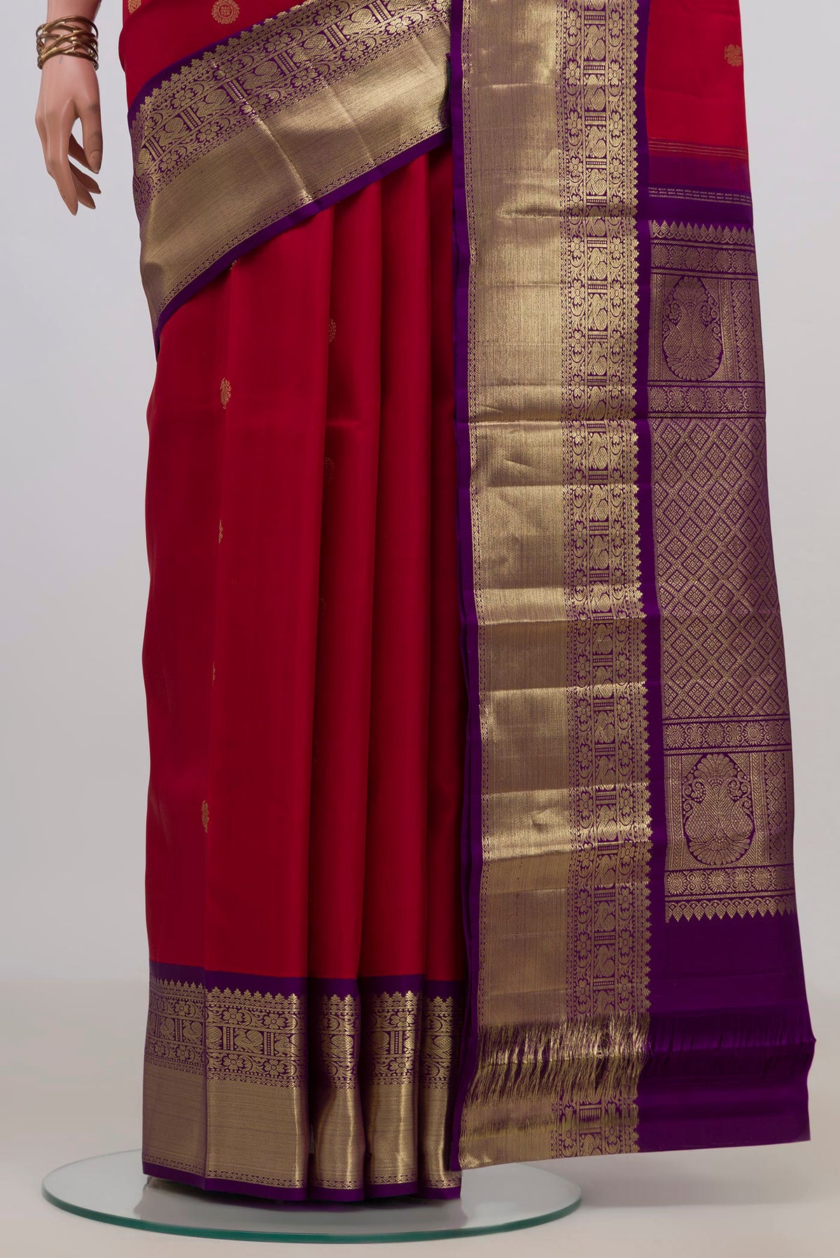 Pleats and pallu of Pure Silk Red Kanjivaram Saree with Zari Butta on the body and Zari Border. 
