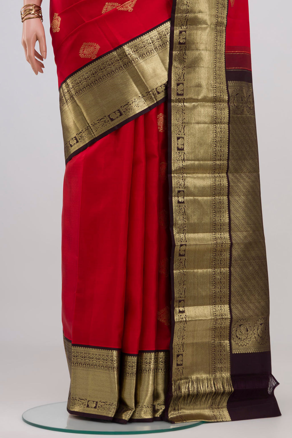 Pleats and pallu of Red Kanjivaram Silk Saree with Zari Butta on the body and Zari Border. 