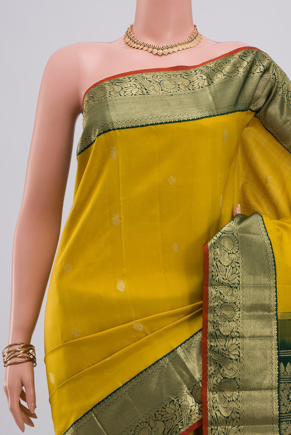 Border image of Yellow Kanjivaram Silk Saree with Zari Butta on the body and Zari Border. 