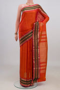 Pure Silk Orange Kanjivaram Saree with Zari Butta on the body and Zari Border.  displayed on a mannequin