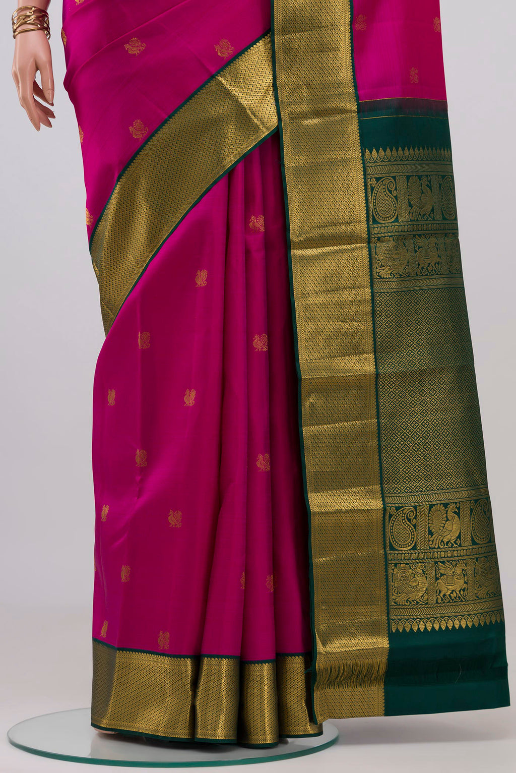 Pleats and pallu of Pink Kanjivaram Silk Saree with Zari Butta on the body and Zari Border. 