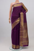 Purple Kanchipuram Silk Saree with Stripes on the body and Zari Border.  displayed on a mannequin