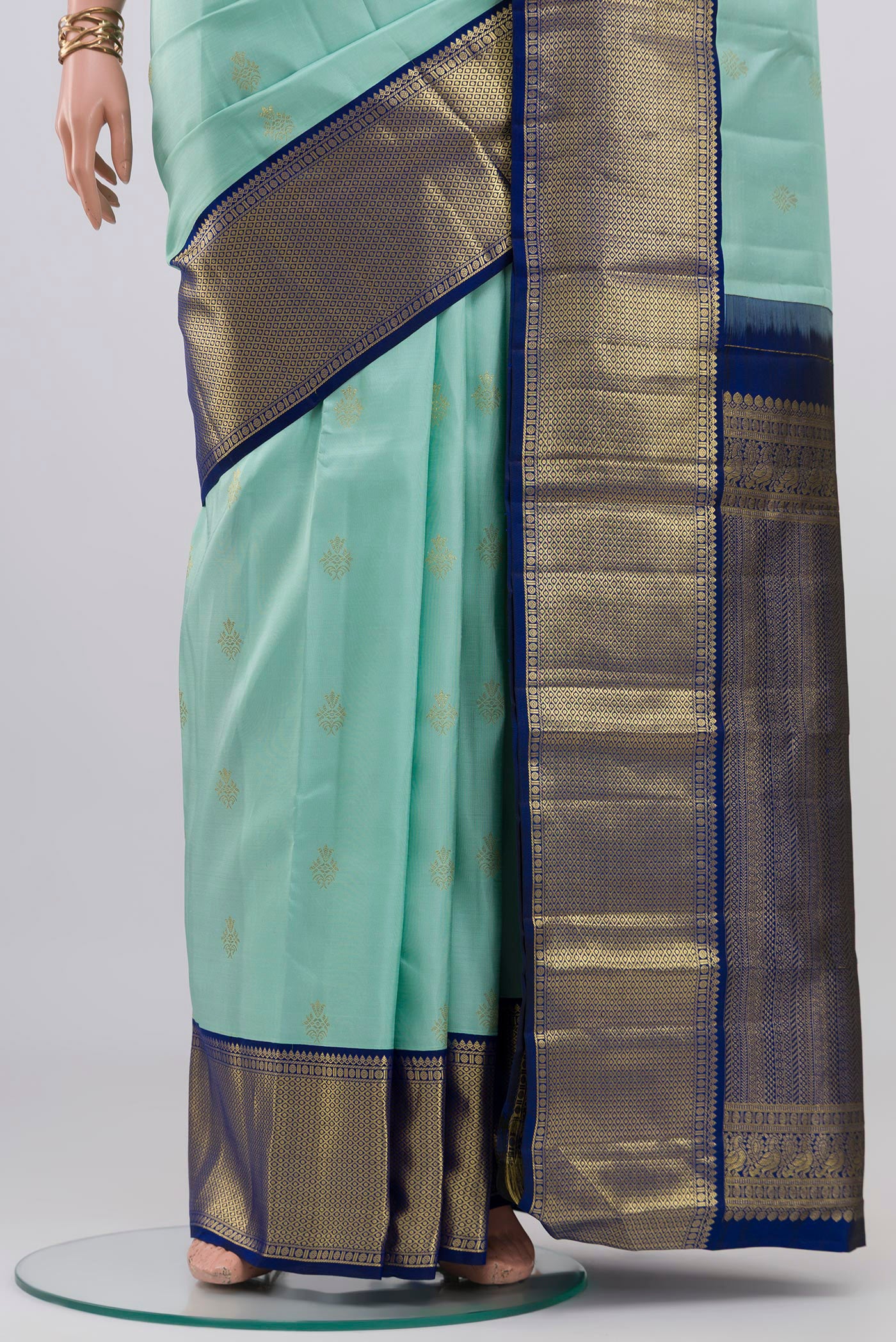 Pleats and pallu of Light Blue Kanjivaram Silk Saree with Zari Butta on the body and Zari Border. 