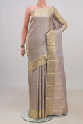 Pure Silk Grey Kanchipuram Saree with Zari Brocade on the body and Zari Border.  displayed on a mannequin