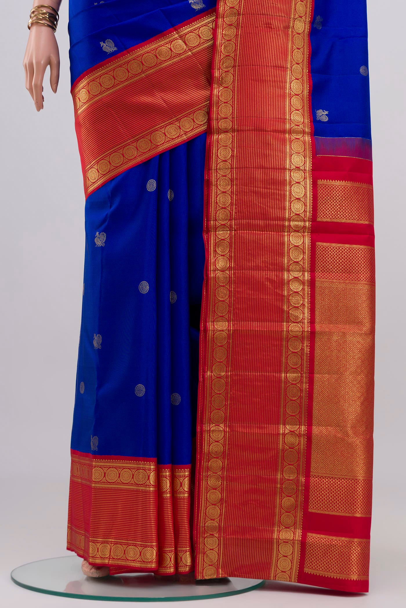 Pleats and pallu of Royal Blue Kanjivaram Silk Saree with Zari Butta on the body and Zari Border. 