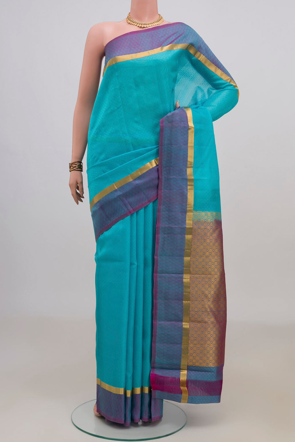 Pure Silk Sky Blue Kanjivaram Saree with Jacquard design on the body and Thin Zari Line.  displayed on a mannequin