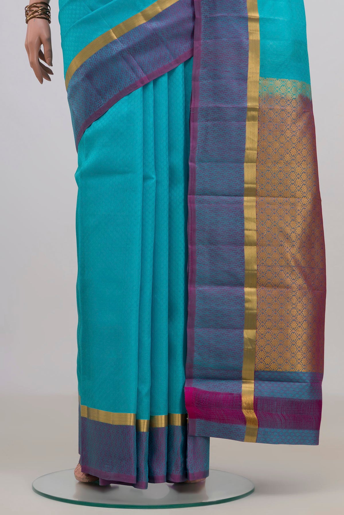 Pleats and pallu of Pure Silk Sky Blue Kanjivaram Saree with Jacquard design on the body and Thin Zari Line. 