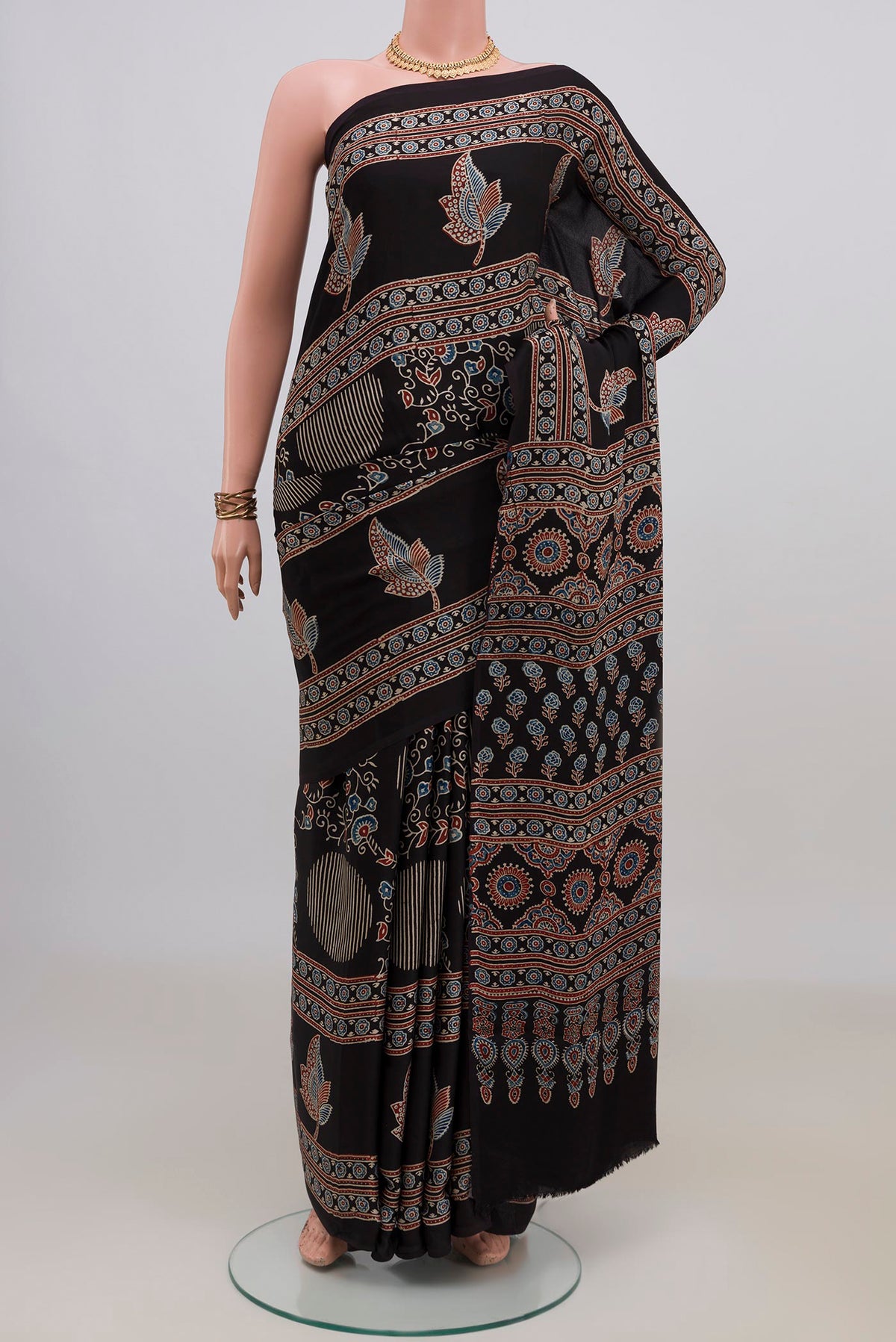 Black Blended Satin Silk Saree with Ajrakh Print on the body and Printed Border.  displayed on a mannequin