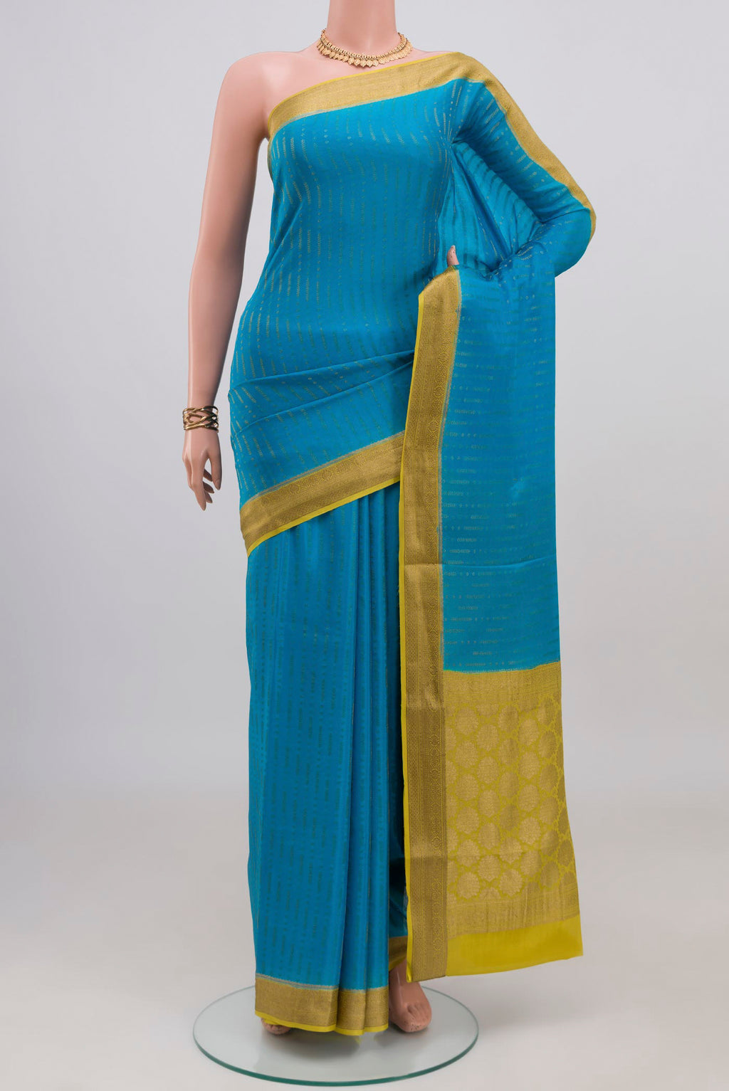Blue Mysore Crepe Saree with Stripes on the body and Zari Border.  displayed on a mannequin