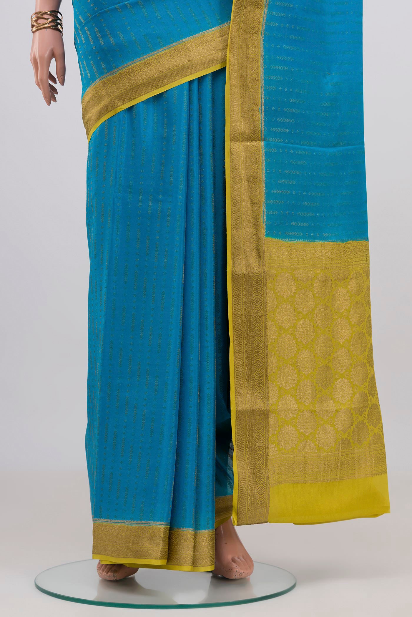 Pleats and pallu of Blue Mysore Crepe Saree with Stripes on the body and Zari Border. 