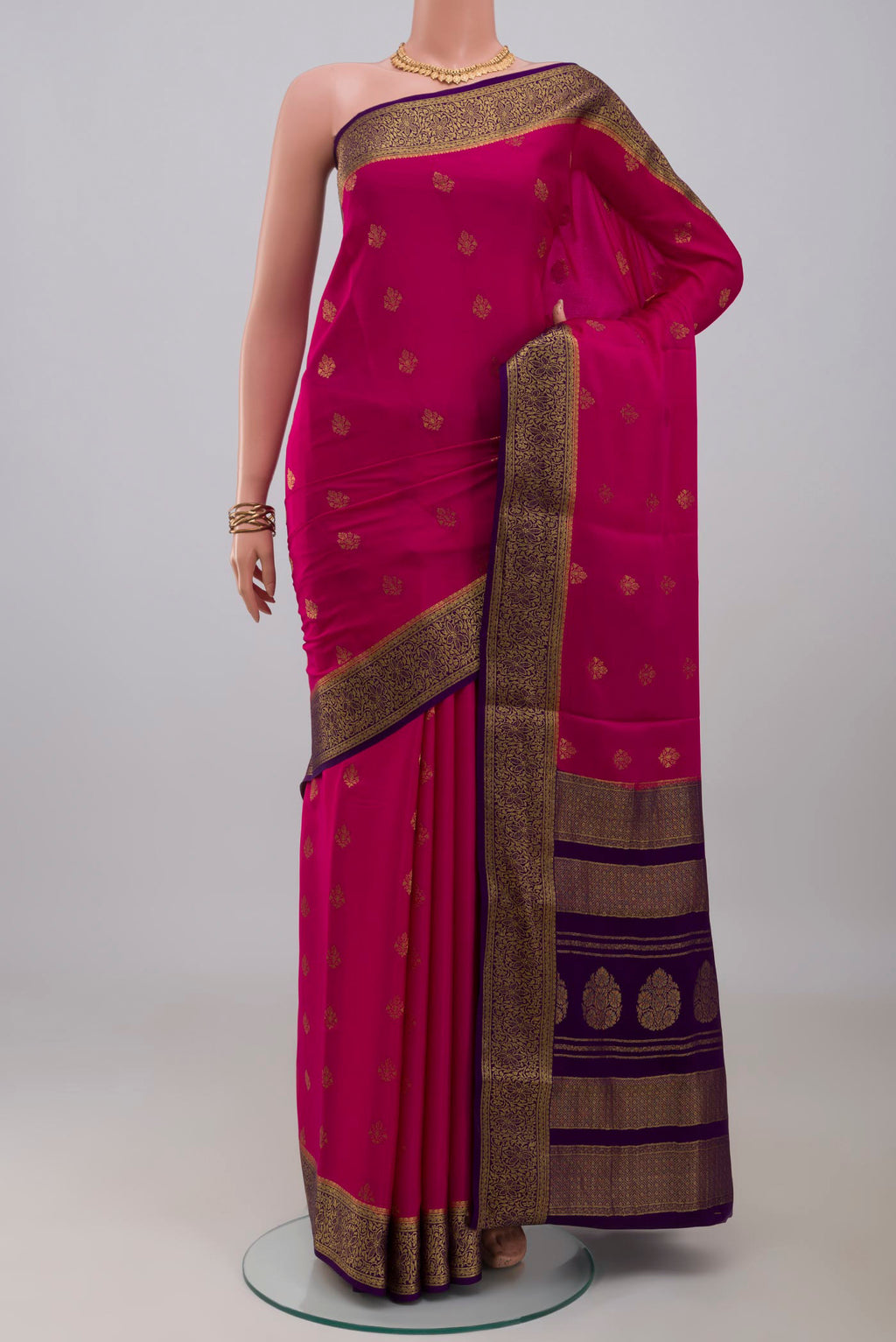 Pink Mysore Crepe Saree with Zari Butta on the body and Zari Border.  displayed on a mannequin