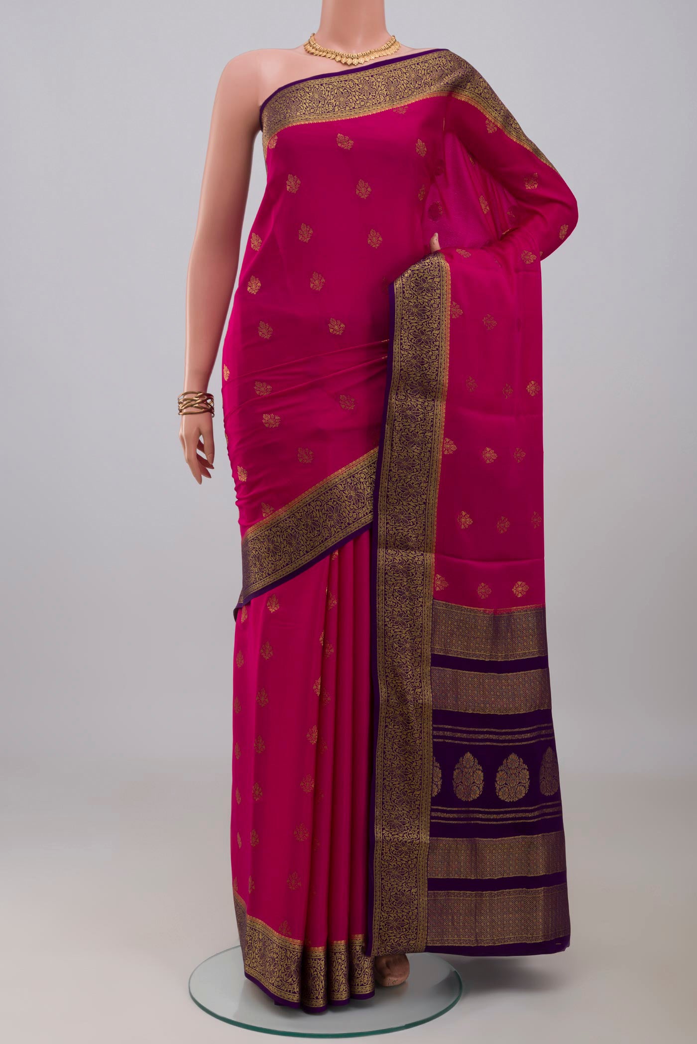Pink Mysore Crepe Saree with Zari Butta on the body and Zari Border.  displayed on a mannequin