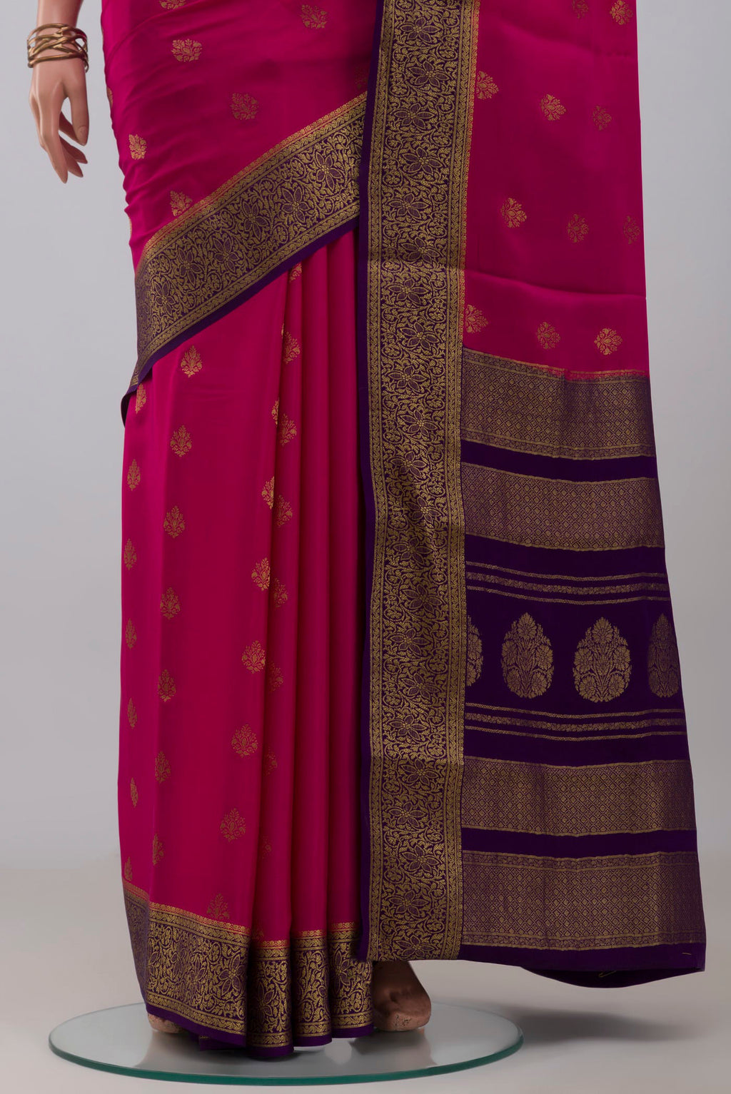 Pleats and pallu of Pink Mysore Crepe Saree with Zari Butta on the body and Zari Border. 