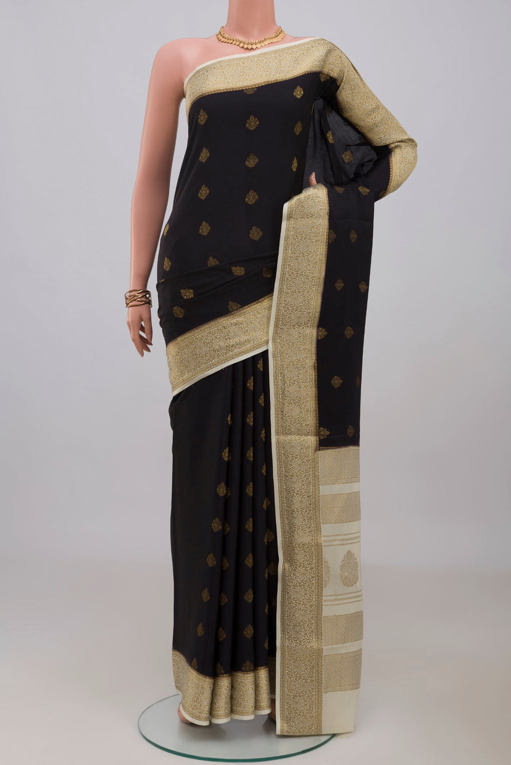 Black Mysore Crepe Saree with Zari Butta on the body and Zari Border.  displayed on a mannequin