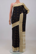 Black Mysore Crepe Saree with Zari Butta on the body and Zari Border.  displayed on a mannequin