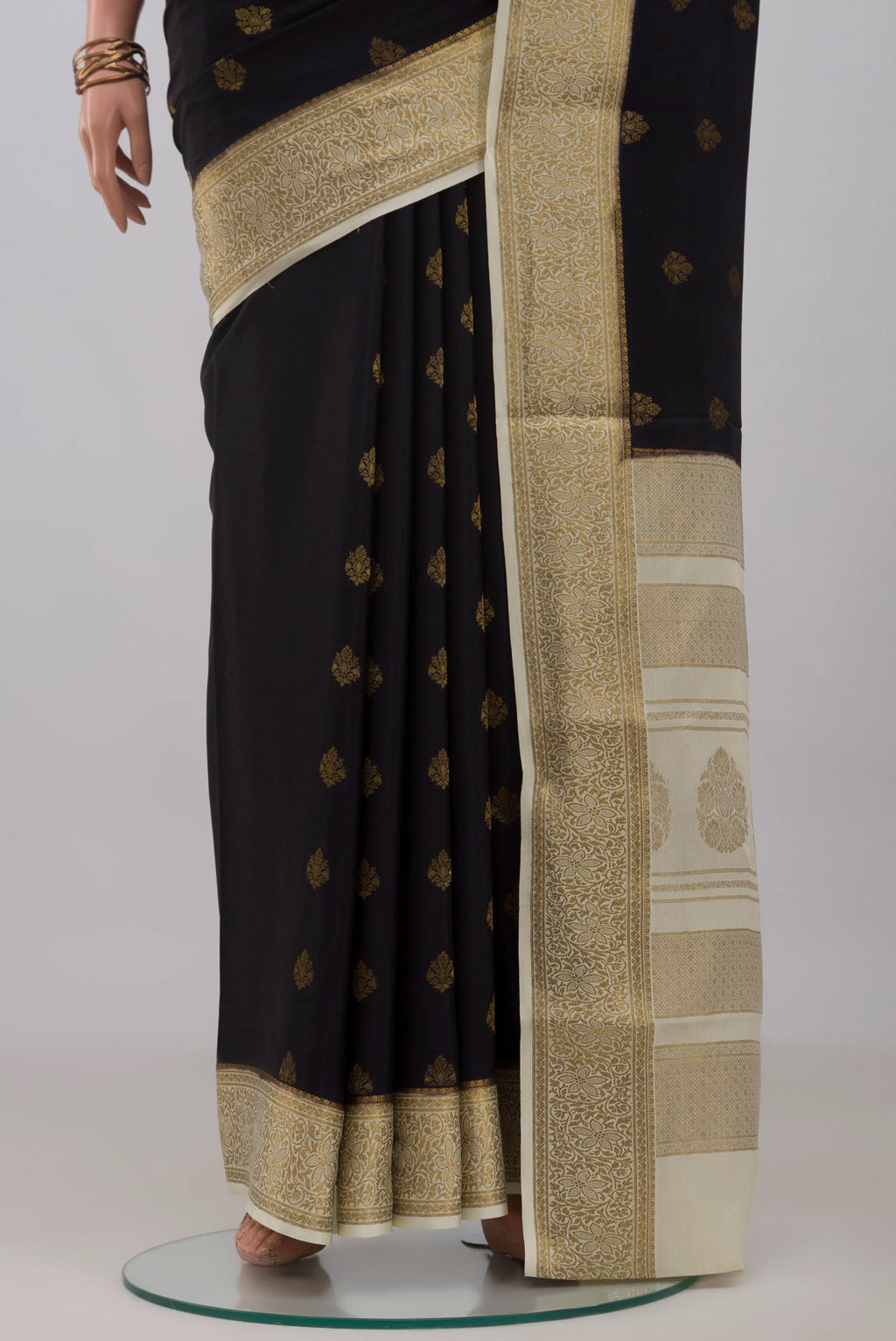 Pleats and pallu of Black Mysore Crepe Saree with Zari Butta on the body and Zari Border. 