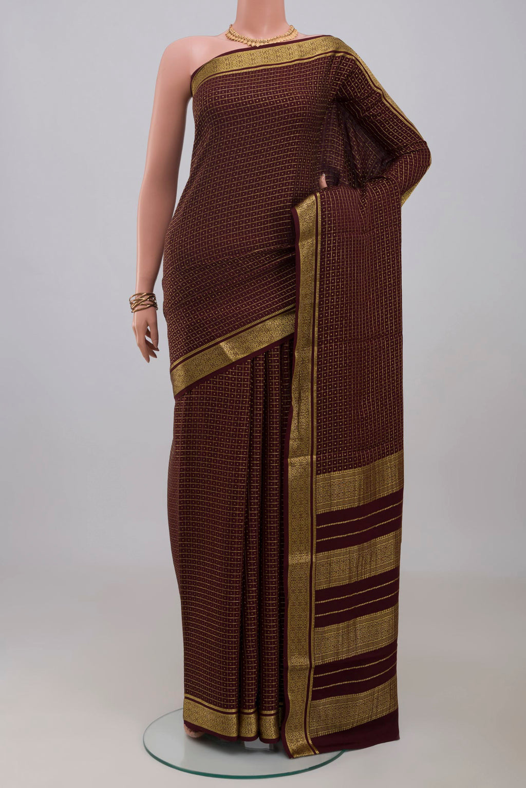 Coffee Brown Mysore Crepe Saree with Checked design on the body and Zari Border.  displayed on a mannequin