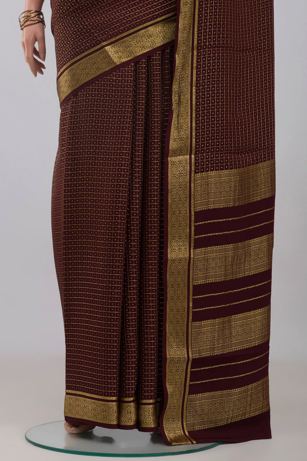 Pleats and pallu of Coffee Brown Mysore Crepe Saree with Checked design on the body and Zari Border. 