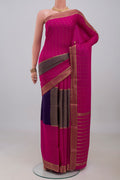Multi Color Mysore Crepe Saree with Checked design on the body and Zari Border.  displayed on a mannequin