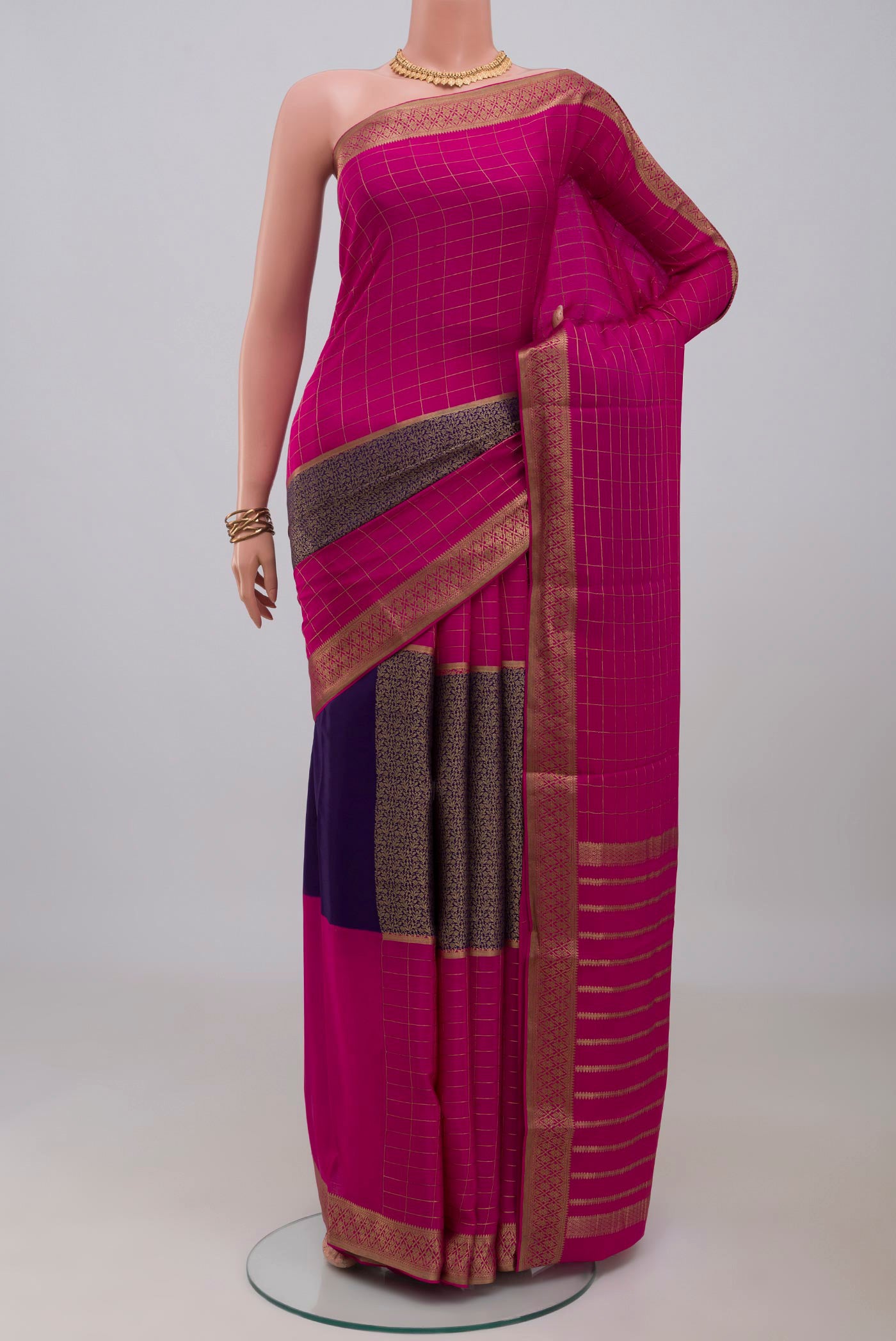 Multi Color Mysore Crepe Saree with Checked design on the body and Zari Border.  displayed on a mannequin
