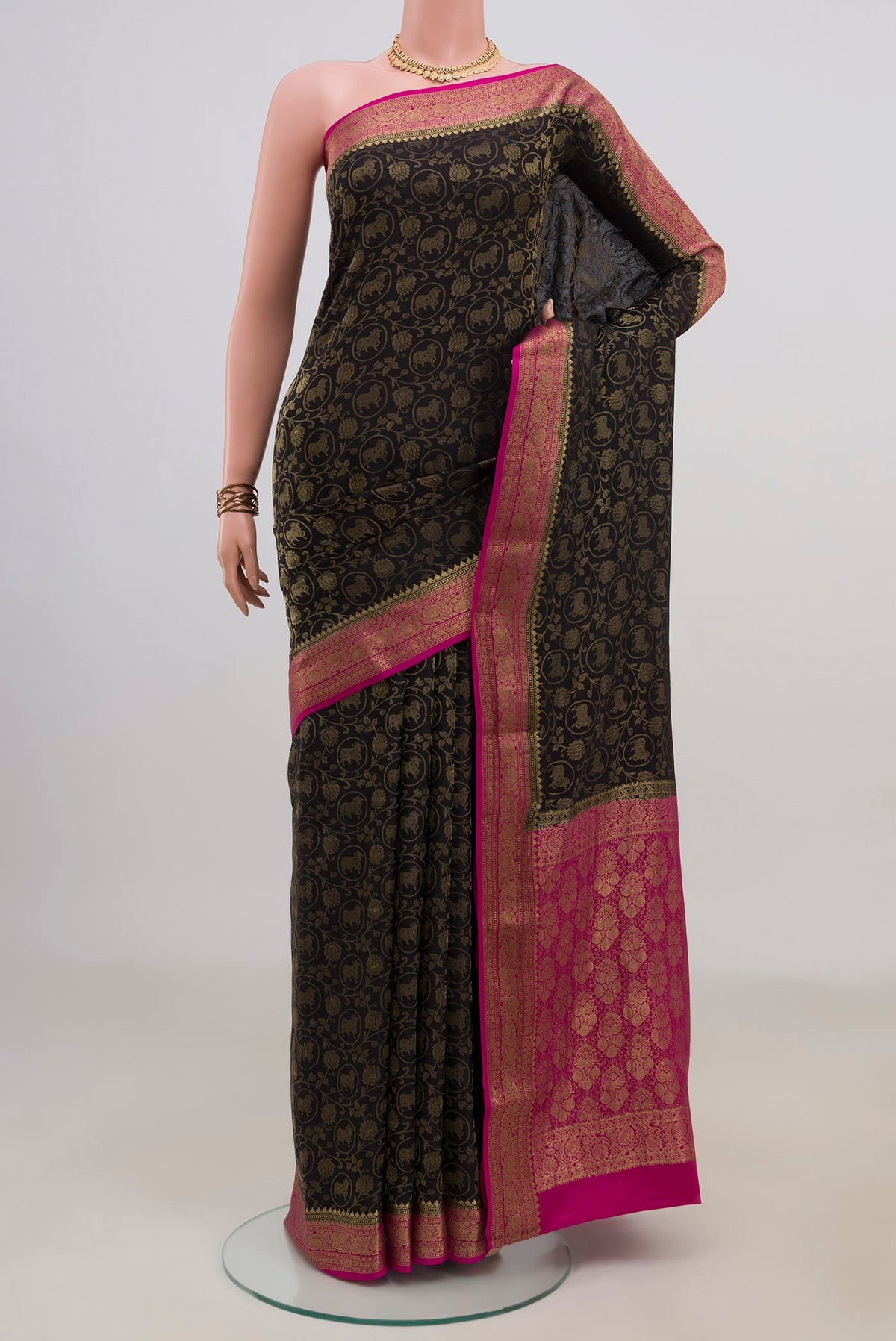Black Mysore Crepe Saree with Zari Brocade on the body and Zari Border.  displayed on a mannequin