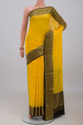 Yellow Mysore Crepe Saree with Zari Butta on the body and Zari Border.  displayed on a mannequin