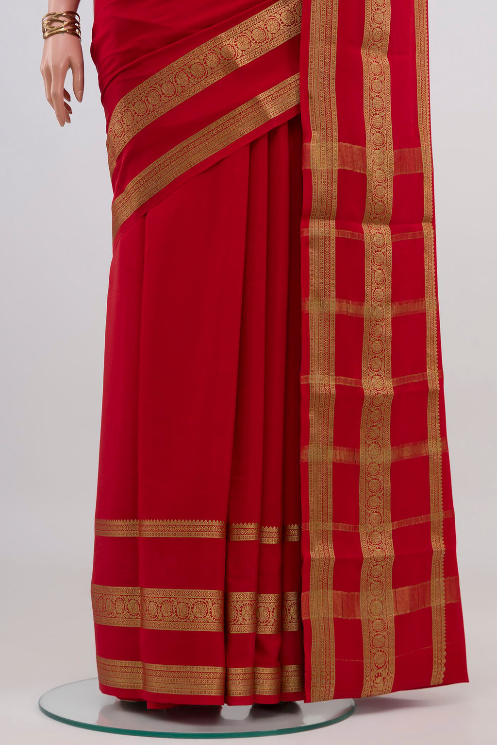 Pleats and pallu of Red Mysore Crepe Saree with Plain Body and Zari Border. 