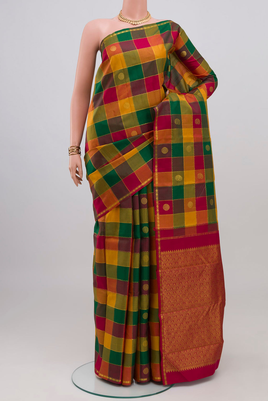 Multi Color Kanchipuram Silk Saree with Checked design on the body and Thin Zari Line.  displayed on a mannequin
