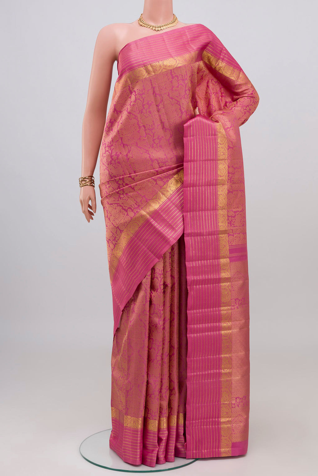 Pure Silk Pure Zari Pink Kanjivaram Saree with Jacquard design on the body and Zari Border.  displayed on a mannequin