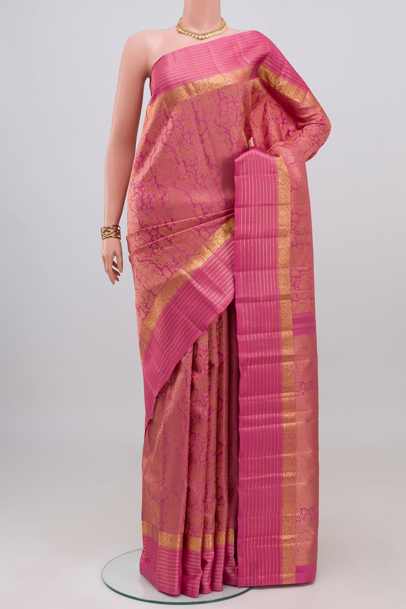 Pure Silk Pure Zari Pink Kanjivaram Saree with Jacquard design on the body and Zari Border.  displayed on a mannequin