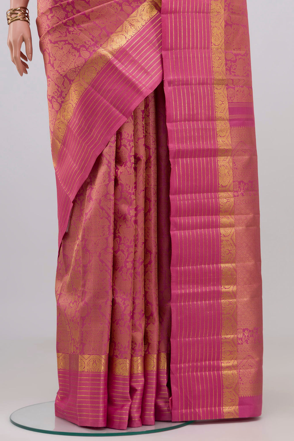 Pleats and pallu of Pure Silk Pure Zari Pink Kanjivaram Saree with Jacquard design on the body and Zari Border. 