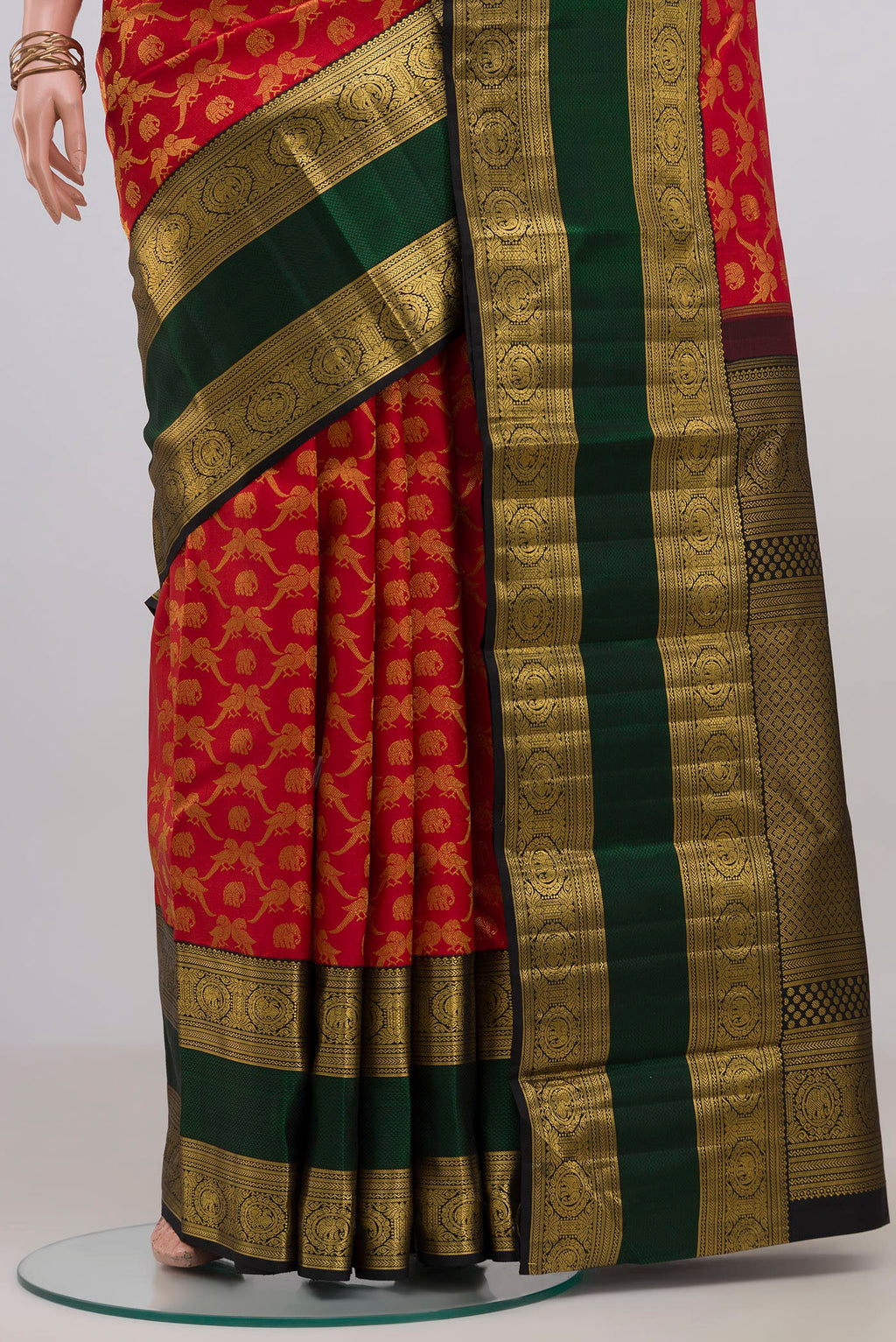 Pleats and pallu of Red Kanchipuram Silk Saree with Zari Brocade on the body and Zari Border. 