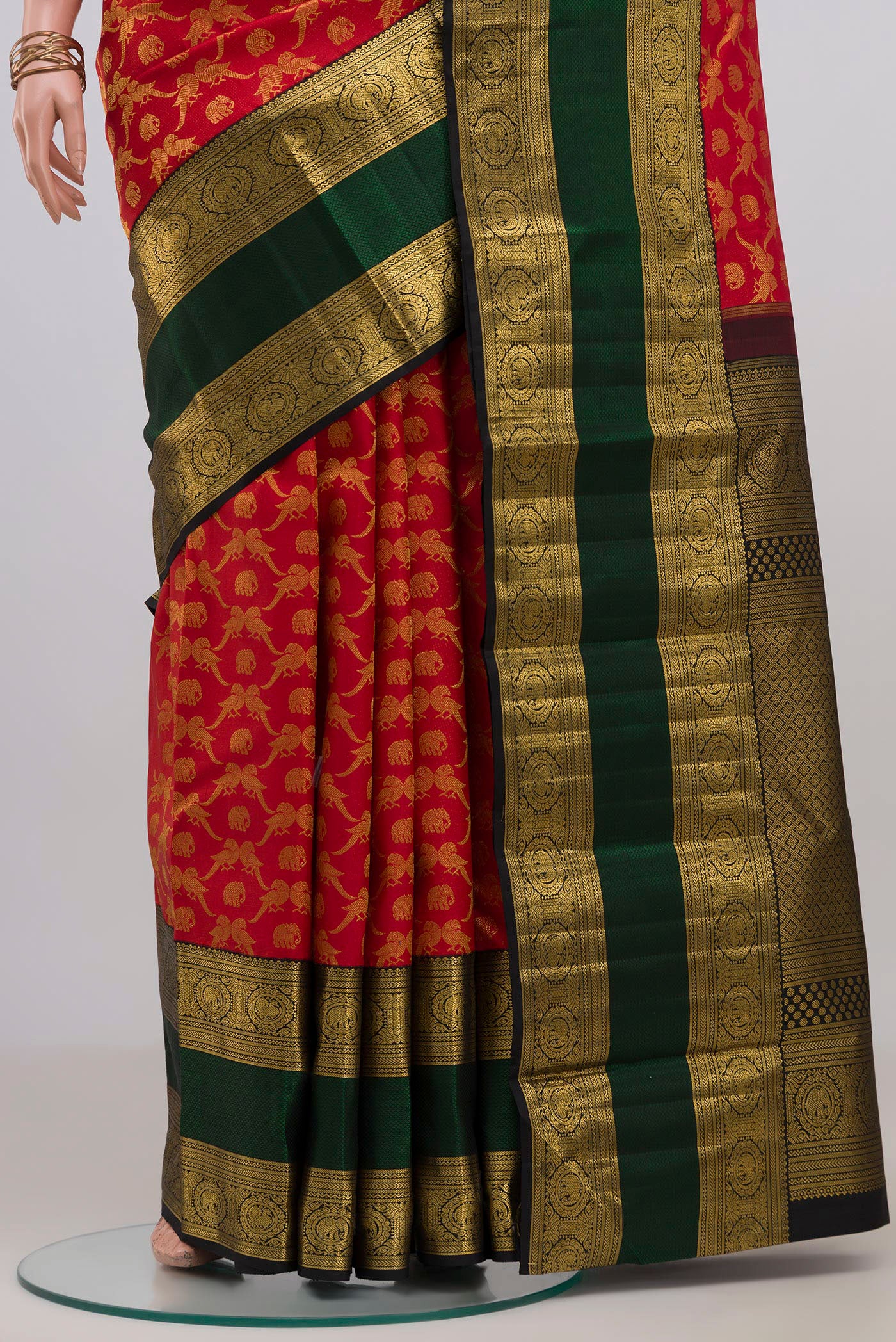 Pleats and pallu of Red Kanchipuram Silk Saree with Zari Brocade on the body and Zari Border. 