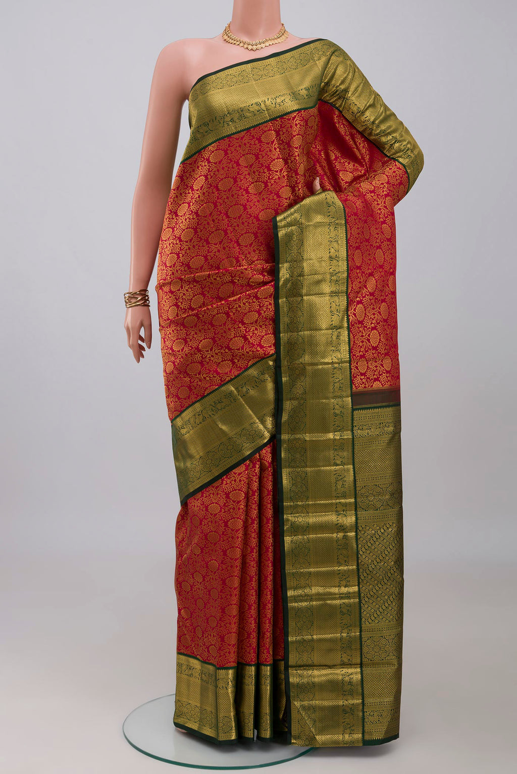 Red Kanchipuram Silk Saree with Zari Brocade on the body and Zari Border.  displayed on a mannequin
