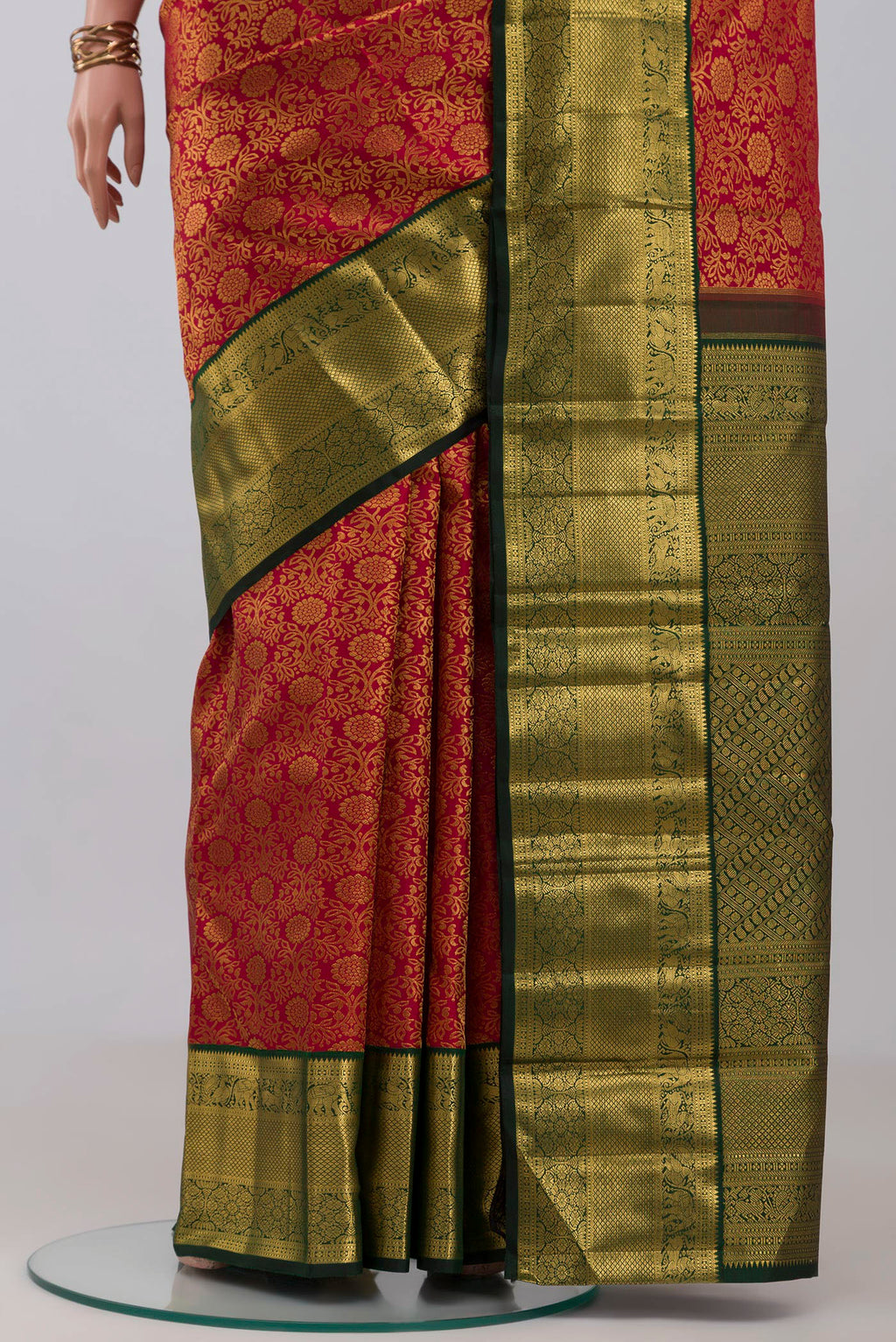 Pleats and pallu of Red Kanchipuram Silk Saree with Zari Brocade on the body and Zari Border. 