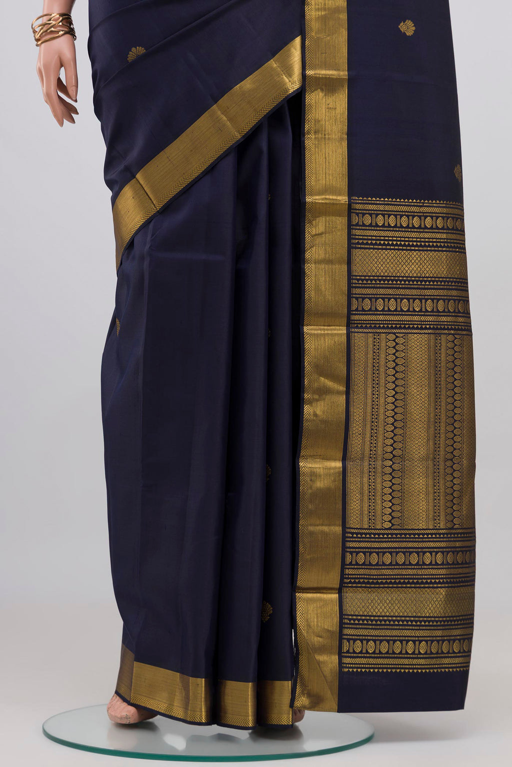 Pleats and pallu of Navy Blue Kanjivaram Silk Saree with Zari Butta on the body and Zari Border. 