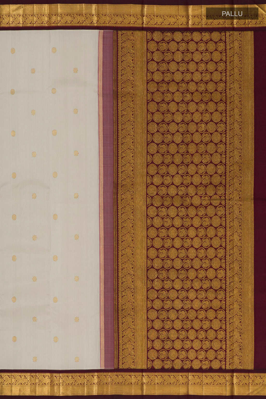 Close up image of the pallu of Pure Silk Pure Zari Cream Kanchipuram Saree with Zari Butta on the body and Zari Border. 