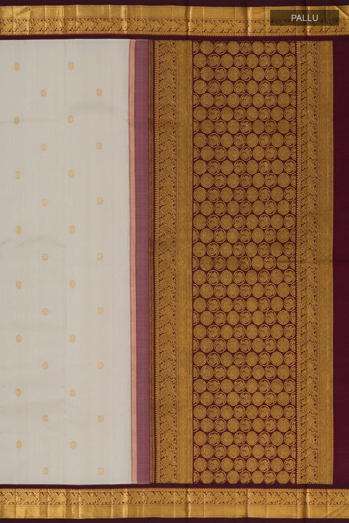 Close up image of the pallu of Pure Silk Pure Zari Cream Kanchipuram Saree with Zari Butta on the body and Zari Border. 