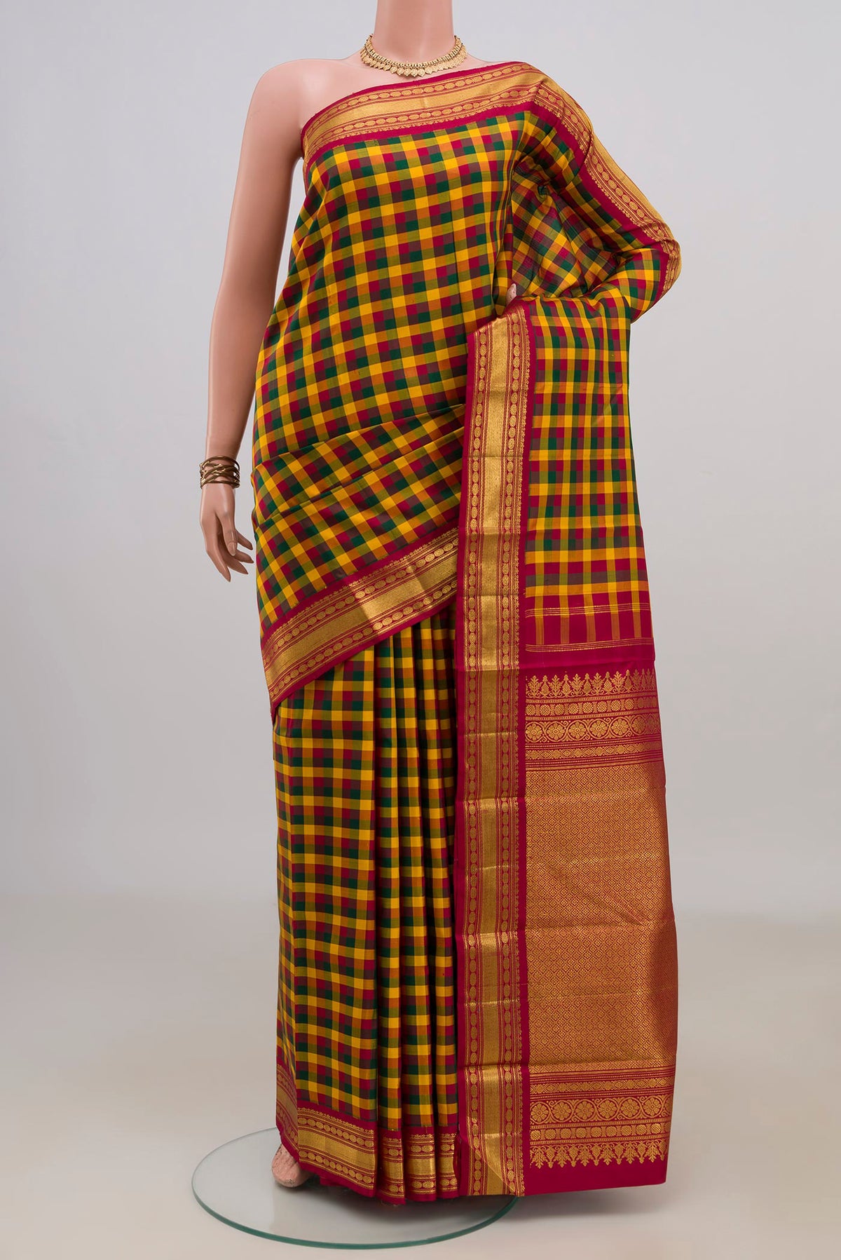 Pure Silk Multi Color Kanchipuram Saree with Checked design on the body and Zari Border.  displayed on a mannequin