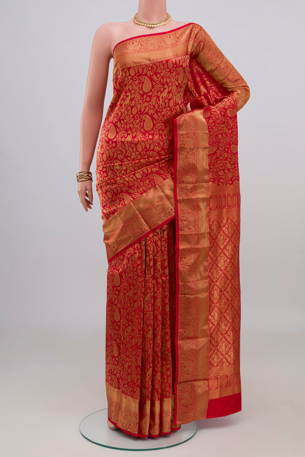 Red Kanjivaram Silk Saree with Zari Brocade on the body and Zari Border.  displayed on a mannequin