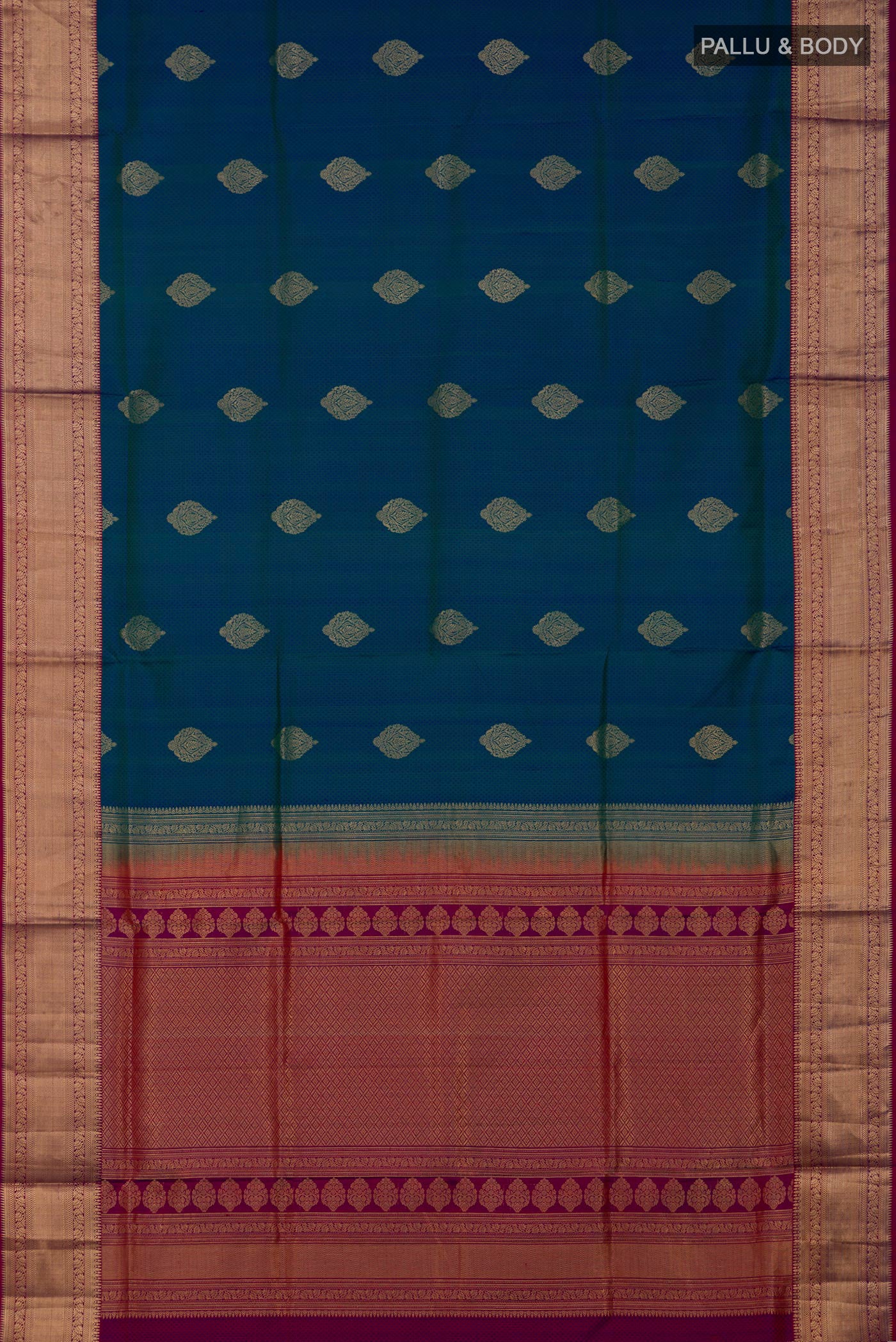 Flat view of Peacock Blue Soft Silk Saree with Jacquard With Zari Butta on the body and Zari Border. 