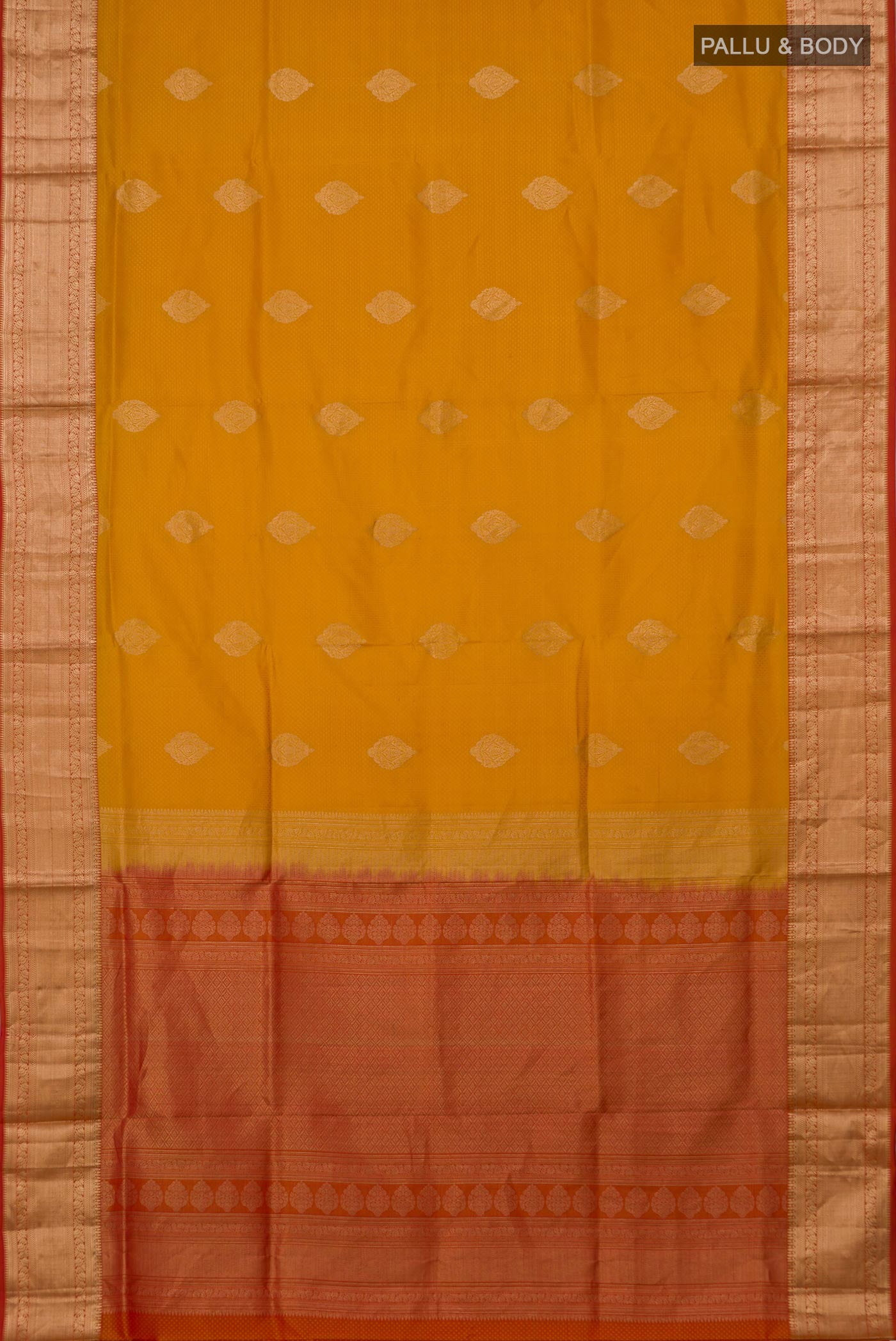 Flat view of Mustard Soft Silk Saree with Zari Butta on the body and Zari Border. 