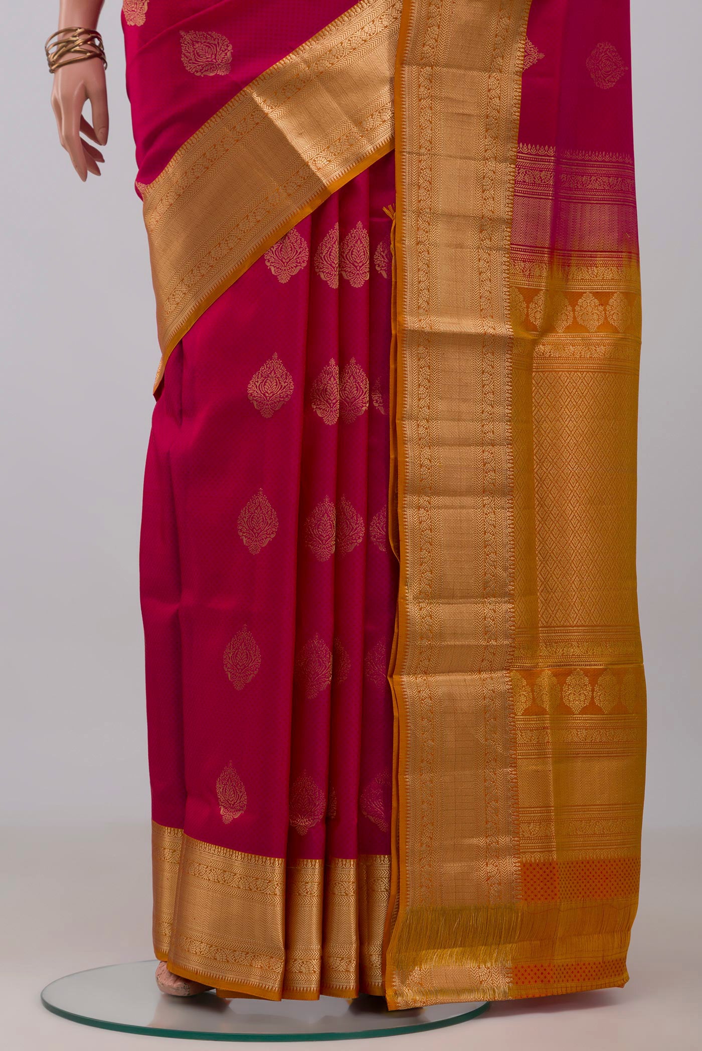 Pleats and pallu of Pink Soft Silk Saree with Jacquard With Zari Butta on the body and Zari Border. 