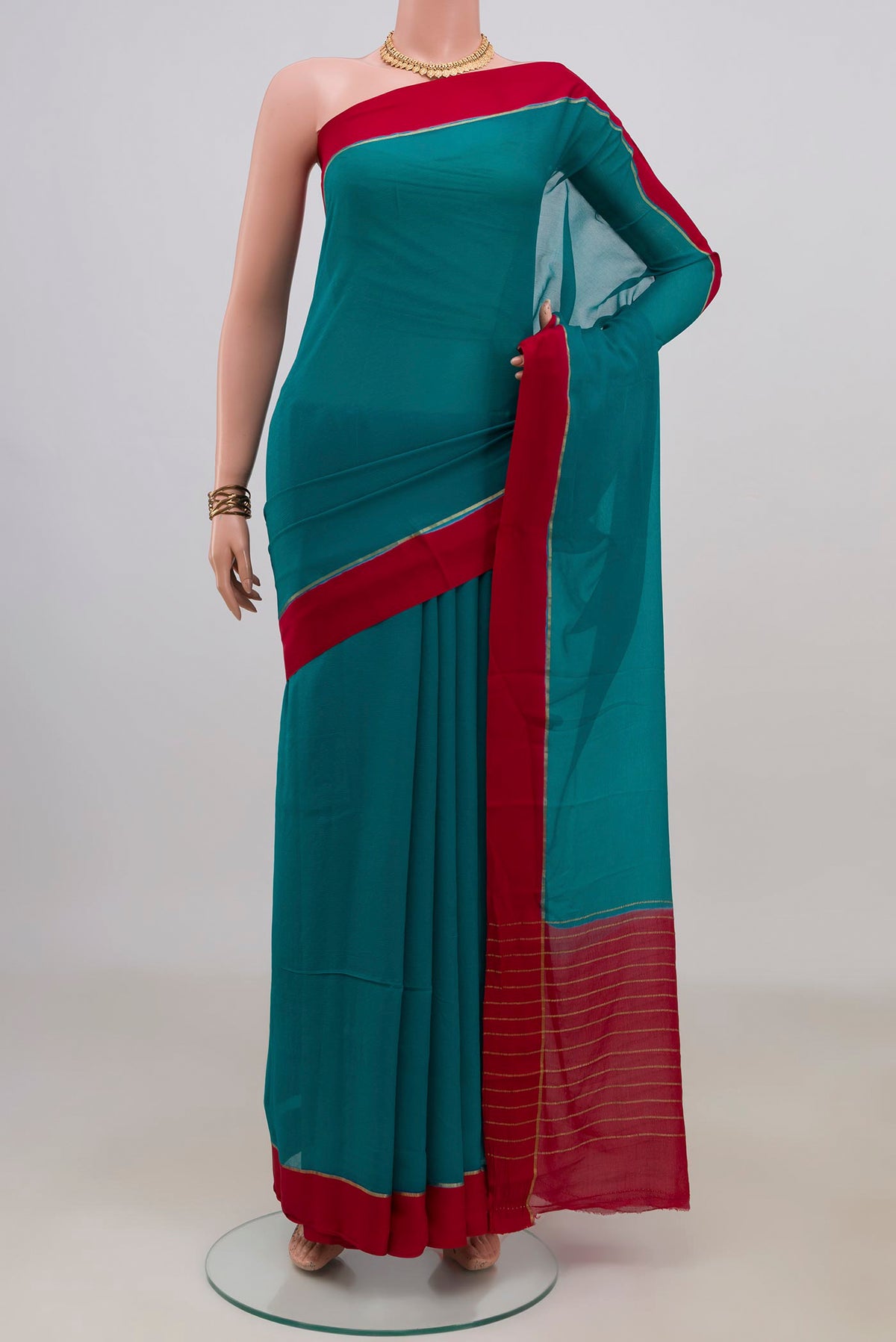 Blue Mysore Chiffon Saree with Plain Body and Thin Zari Line.  displayed on a mannequin