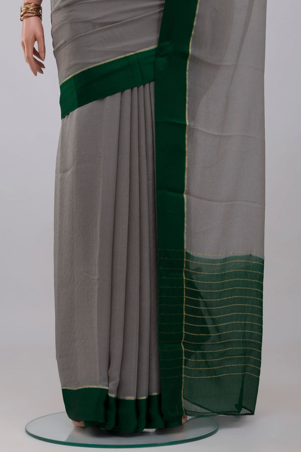 Pleats and pallu of Grey Mysore Chiffon Saree with Plain Body and Thin Zari Line. 