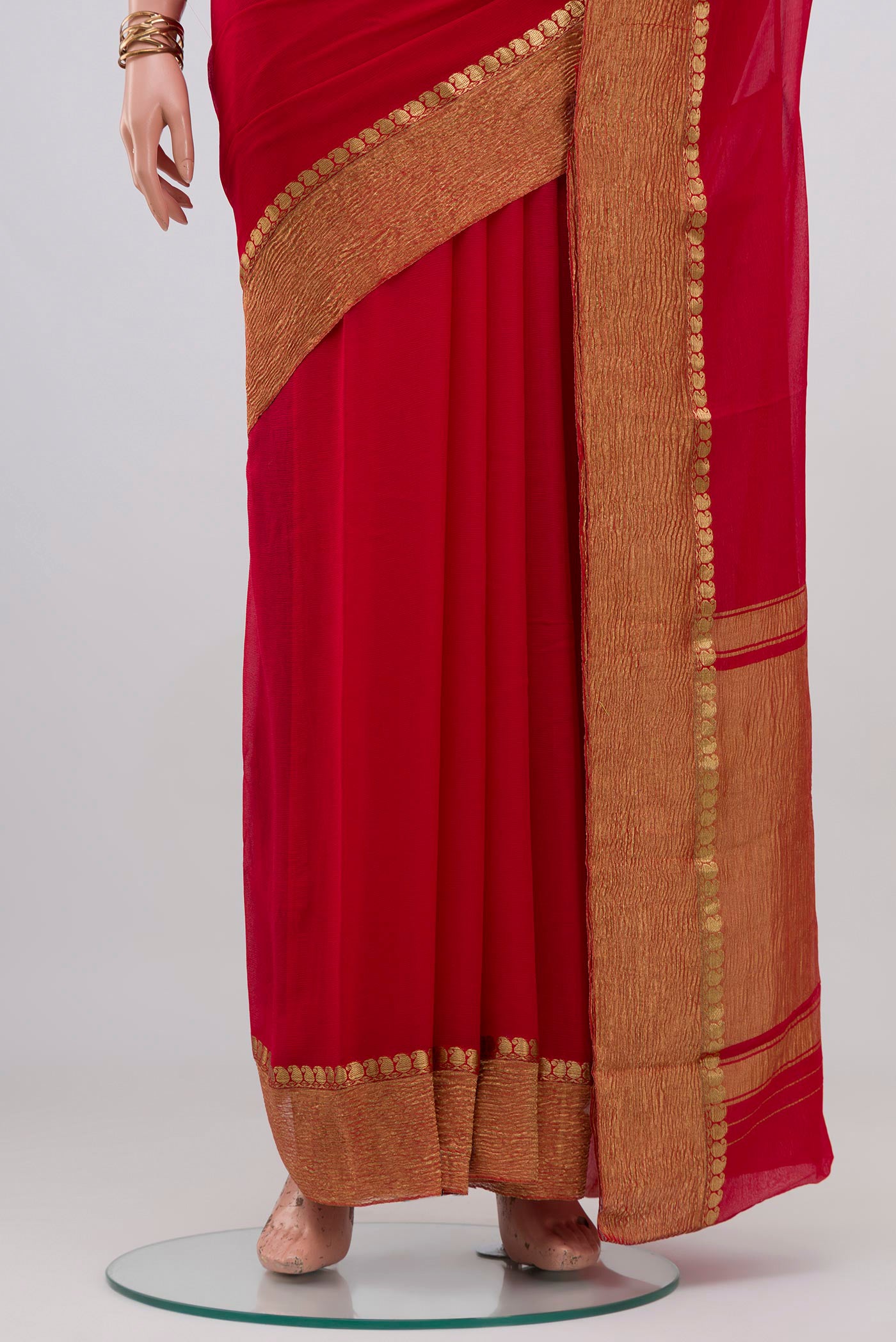 Pleats and pallu of Red Mysore Chiffon Saree with Plain Body and Crushed Broder. 