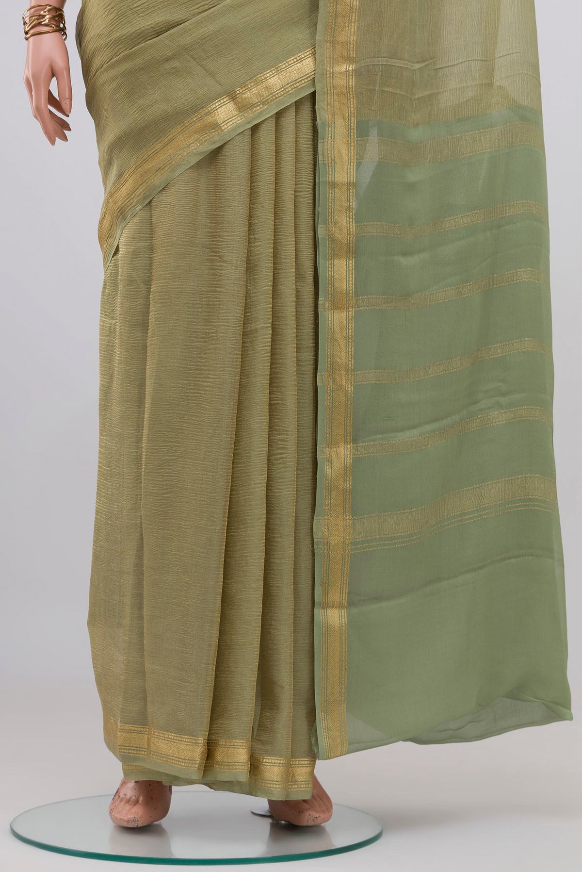 Pleats and pallu of Gold Mysore Georgette Saree with Plain Body and Zari Border. 