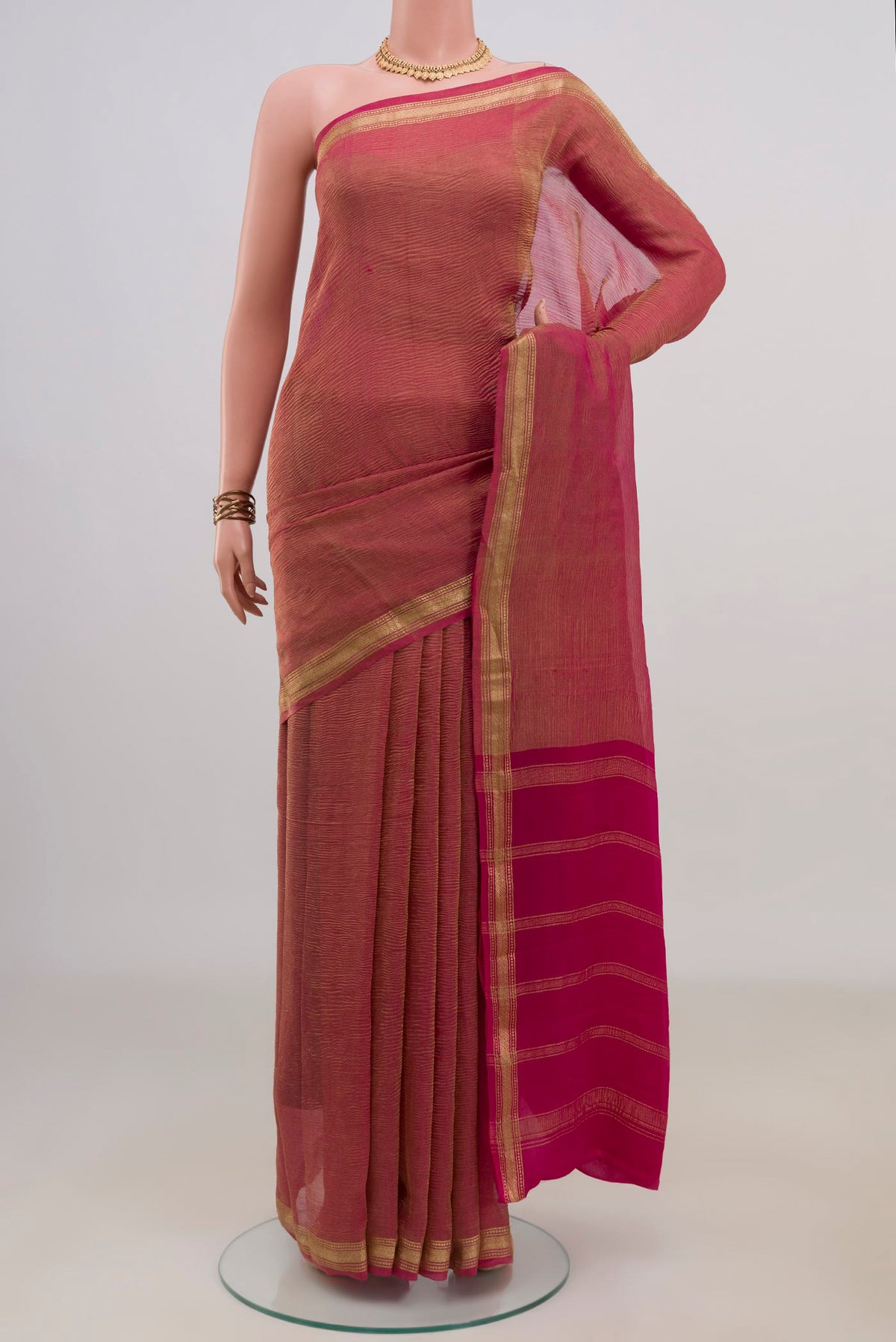 Pink Mysore Georgette Saree with Plain Body and Zari Border.  displayed on a mannequin