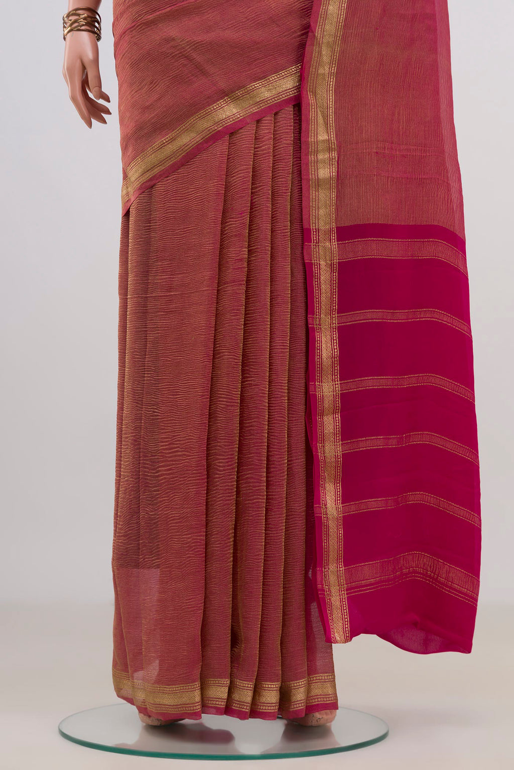 Pleats and pallu of Pink Mysore Georgette Saree with Plain Body and Zari Border. 